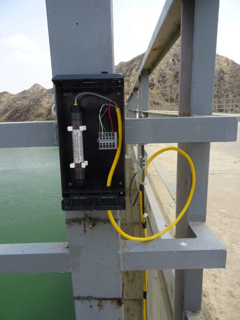 Vented vibrating wire piezometer VWP-3310 mounted in junction box on railing a top of Baish dam