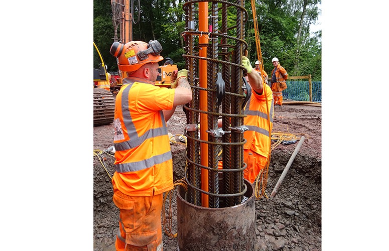 Lowering pile cage with QJ inclinometer and VWS-2100 strain gauges installed