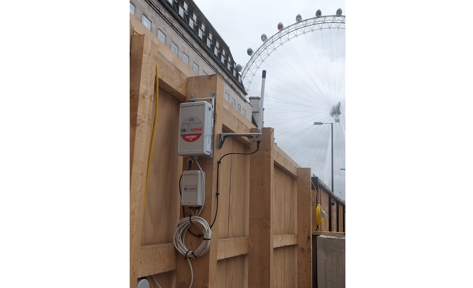 WI-SOS 480 Gateway mounted on site fence post with London Eye in the background
