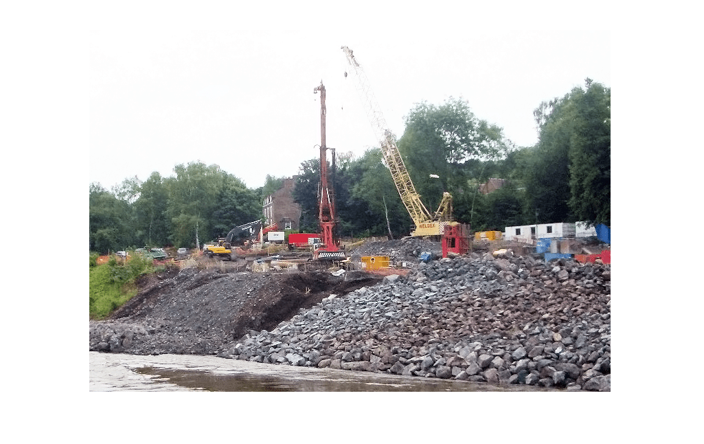 Piling activity along bank of river severn