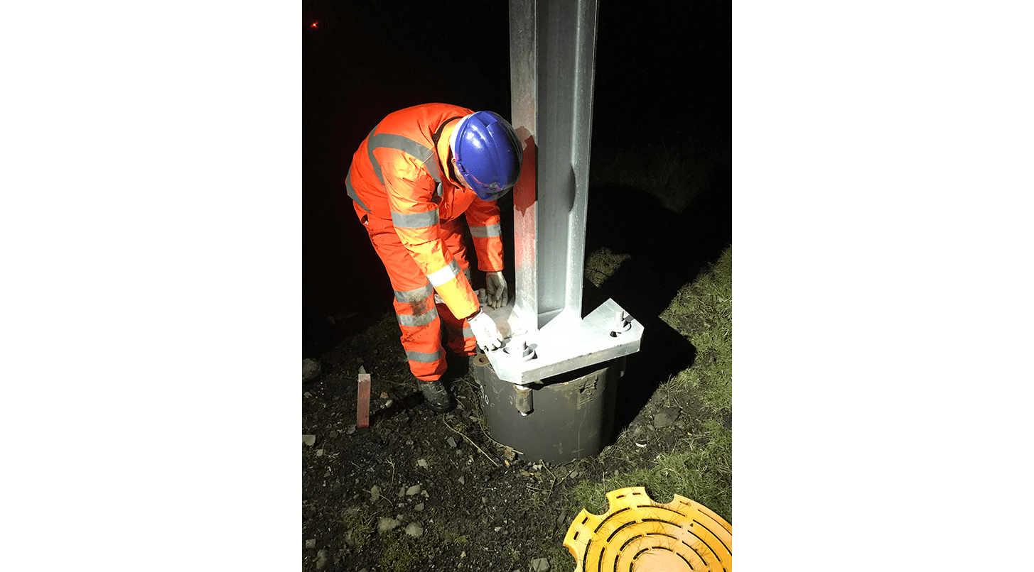 Engineer installing WI-SOS 480 on gantry base on the Chase line