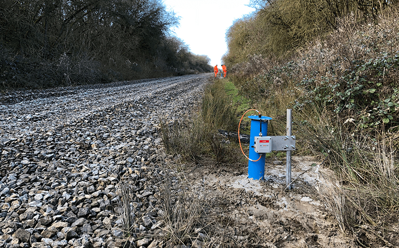 WI-SOS 480 single channel Node for VW piezometer and borehole cover next to rail track